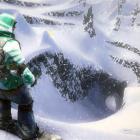 A snowboarder pauses before tackling a mountain in the yet-to-be-released EA Games SSX, which...