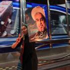 A supporter of moderate cleric Hassan Rohani celebrates his victory in Iran's presidential...