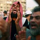 A supporter of the Muslim Brotherhood shouts during a sit-in protest against the military council...