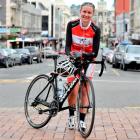 A tired Irene Le Fleming (19), of Waimate, leans on her bike in Dunedin's Octagon yesterday,...