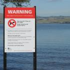 A toxic algae warning sign at Lake Waihola