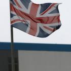 A union flag flies over the entrance to the naval dockyards, where BAE Systems are also located,...