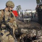 A US soldier views the scene of a suicide attack in Jalalabad, Afghanistan on Wednesday. The...