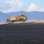 A water tanker is driven past grassland blackened by fire at Cornaig Farm, near Wedderburn. Photo...