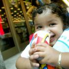 A young girl takes a drink of a soda outside a McDonald's restaurant near Times Square in New...
