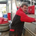 Aad van Leeuwen with, at left, an automated sweeping robot, called Rob, after his bank manager,...
