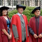 Abby Suszko, Prof John Dawson and Chinese scholar Xiju Zhao prepare to graduate from the...