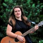 Abby Wolfe strums up a tune as she prepares to represent New Zealand at the World Championships...