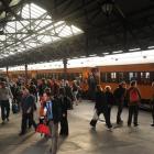 About 200 people get off a commuter train from Waitati at Dunedin Railway Station yesterday as...