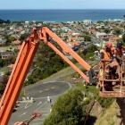 Abseilers Matt Smith (left), of Christchurch, and Mac Watson, of Wanaka,  work on rock...