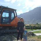 ack's Point resident Sarah Somerville stands with her son Noah Clarke (4) at the construction...