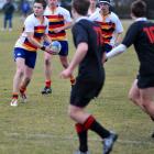 Action from the match between John McGlashan College and Waitaki Boys' High School. Photo by...