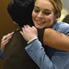 Actress Lindsay Lohan hugs her attorney Shawn Holley in this March file photo. REUTERS/Joe Klamar...