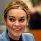 Actress Lindsay Lohan smiles during a progress report hearing at Airport Branch Courthouse in Los...