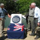 Admiring the new plaque outside the old doctor's residence in Kurow are, from left, Jim Meehan,...