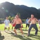 After the prizegiving, Hud Rapata, of Queenstown (centre) led the players from the two final...