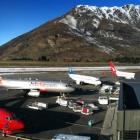 aircraft_parked_at_busy_queenstown_airport_photo_s_4d83289782.JPG