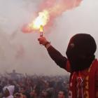 Al Ahly fans, also known as 'Ultras', celebrate and shout slogans in front of the Al Ahly club...