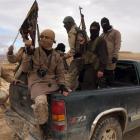 Al Qaeda-linked Nusra Front fighters during the release on December 1 of Lebanese soldiers and...