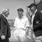 Alexander Downes (left) is congratulated on his 80th birthday by Otago and New Zealand cricketers...