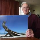 Alexandra resident Gordon Ramage with a photo of his son's sculpture which has been selected for...