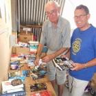 Alexandra Rotary Club book sale convener Ken Cook (left) and club president Mark Willyams sort...