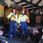 Alexandra volunteer firefighters Shane Ryan and Nathan Mawhinney survey the damage to the kitchen...