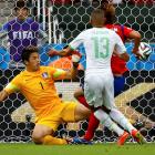 Algeria's Islam Slimani scores past South Korea's goalkeeper Jung Sung-ryong. REUTERS/Damir Sagolj