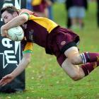 Alhambra-Union fullback Corey McFadzean scores a try during the game against Taieri at the North...