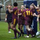 Alhambra-Union prop Scott Manson is congratulated by team-mates after scoring the second try in...