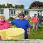 Alison and Peter Appleby (front), in front of their Waitati home, which was recently insulated ...