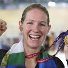 Alison Shanks celebrates after winning gold in the individual pursuit in Delhi. Photo by <i>The...