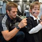 All Black captain Richie McCaw signs a jersey for Elizabeth Darling (6), of Dunedin, at Champions...