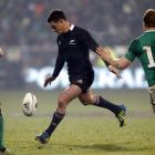 All Black first five Dan Carter kicks a drop goal during the second test against Ireland in...