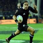 All Black halfback Aaron Smith celebrates before scoring the crucial try in the second half....