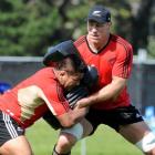 All Black hooker Keven Mealamu (left) and lock Brad Thorn at training yesterday. Photo by Craig...