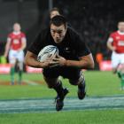 All Black replacement winger Richard Kahui scores a try against Wales at Carisbrook on Saturday....