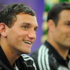 All Blacks first five-eighth Aaron Cruden answers questions as winger Richard Kahui looks on...