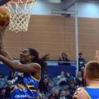 Warren Carter he finds the hoop during the Nuggets' match against the  Canterbury Rams at the...