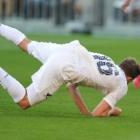 All White striker  Jeremy Brockie is brought down by Mexico's goalkeeper, Moises Munoz, during...