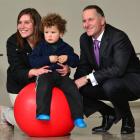 Alora Munro with Vayden Fox (2), of Oamaru, share a moment with Mr Key at the Te Ara shared...