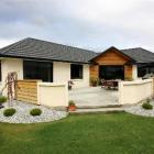This Oamaru stone three-bedroom house by Alpine Homes, of Cromwell, won the supreme award. Photo...