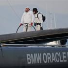 American BMW Oracle owner Larry Ellison, left, and helmsman's James Spithill, right, sail their...