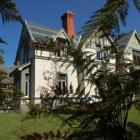 Among the items accumulated by Michael Swann is the historic home Ferntree Lodge. Photo from ODT...