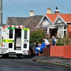 An elderly Tedder St resident is helped into an ambulance by police and St John staff yesterday ...