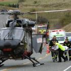 An injured tourist is rushed into the Otago Regional Rescue helicopter on State Highway 8 north...