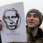 An opposition supporter takes part in a protest rally in central Moscow last Sunday.  Thousands...