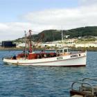 An oyster boat returns to South Port, Bluff, where agriculture imports and exports have...