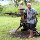 Anderson Dua  stands by the remains of a Japanese bomber. Photos by Gillian Vine.