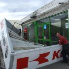 Andy Bolwell, from Colin Clyne Motorcycles, surveys the damaged veranda outside his Thames...